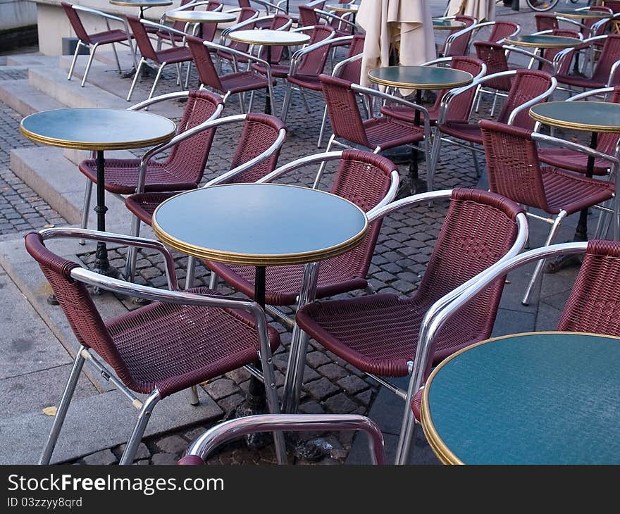 Classic style European street outdoors cafe with tables and chairs Copenhagen Denmark. Classic style European street outdoors cafe with tables and chairs Copenhagen Denmark