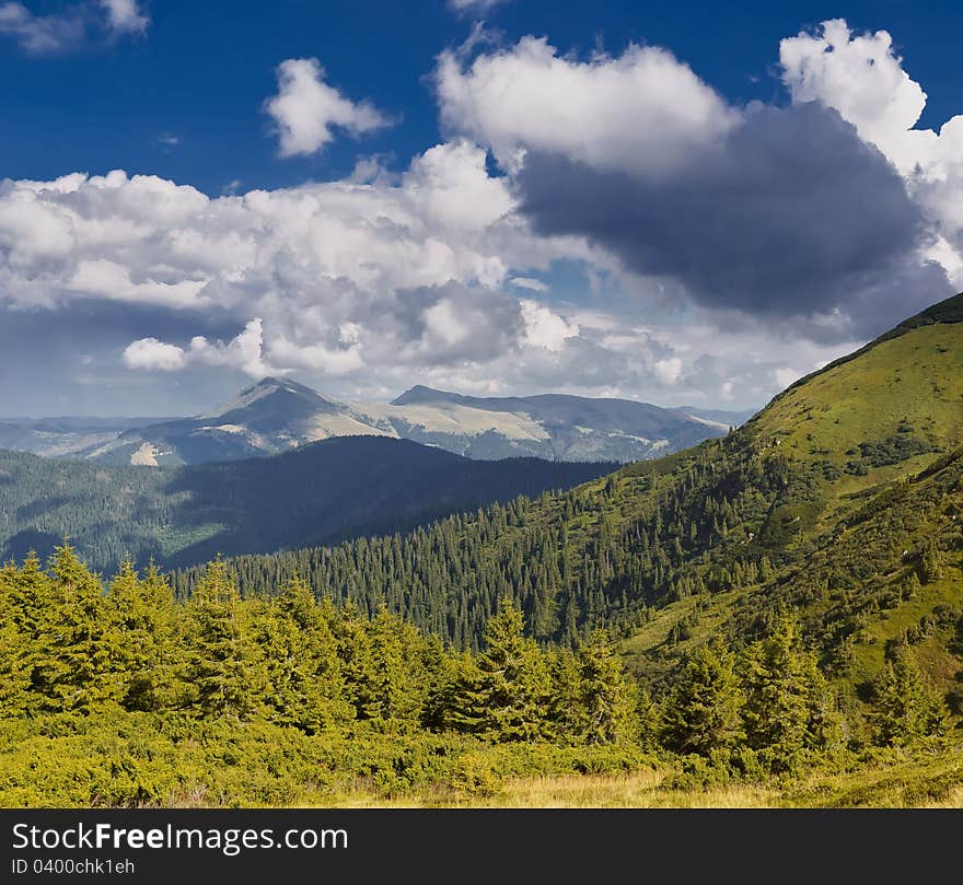 Summer sunny landscape with a cloudy sky. Ukraine, the Carpathian mountains. Summer sunny landscape with a cloudy sky. Ukraine, the Carpathian mountains.