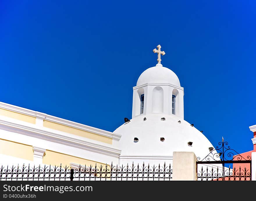 Against the background of blue sky, white dome of a small church looks very bright. He seemed to glow in the sun. Against the background of blue sky, white dome of a small church looks very bright. He seemed to glow in the sun.