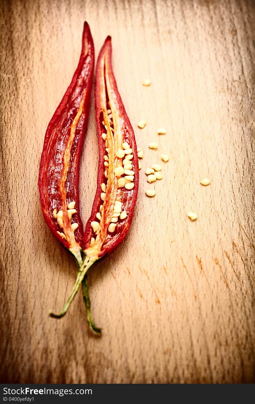 Red hot chili peppers on the wooden board