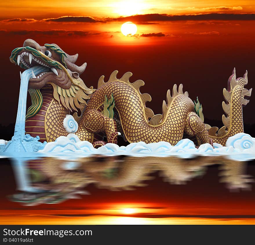 Golden dragon with red column and sunrise.