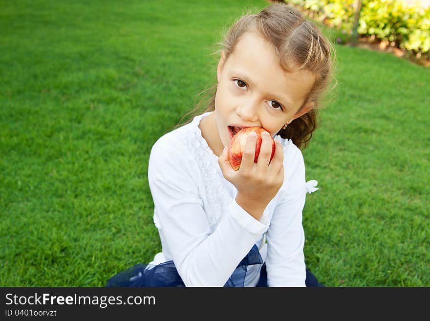 Girl eating an apple