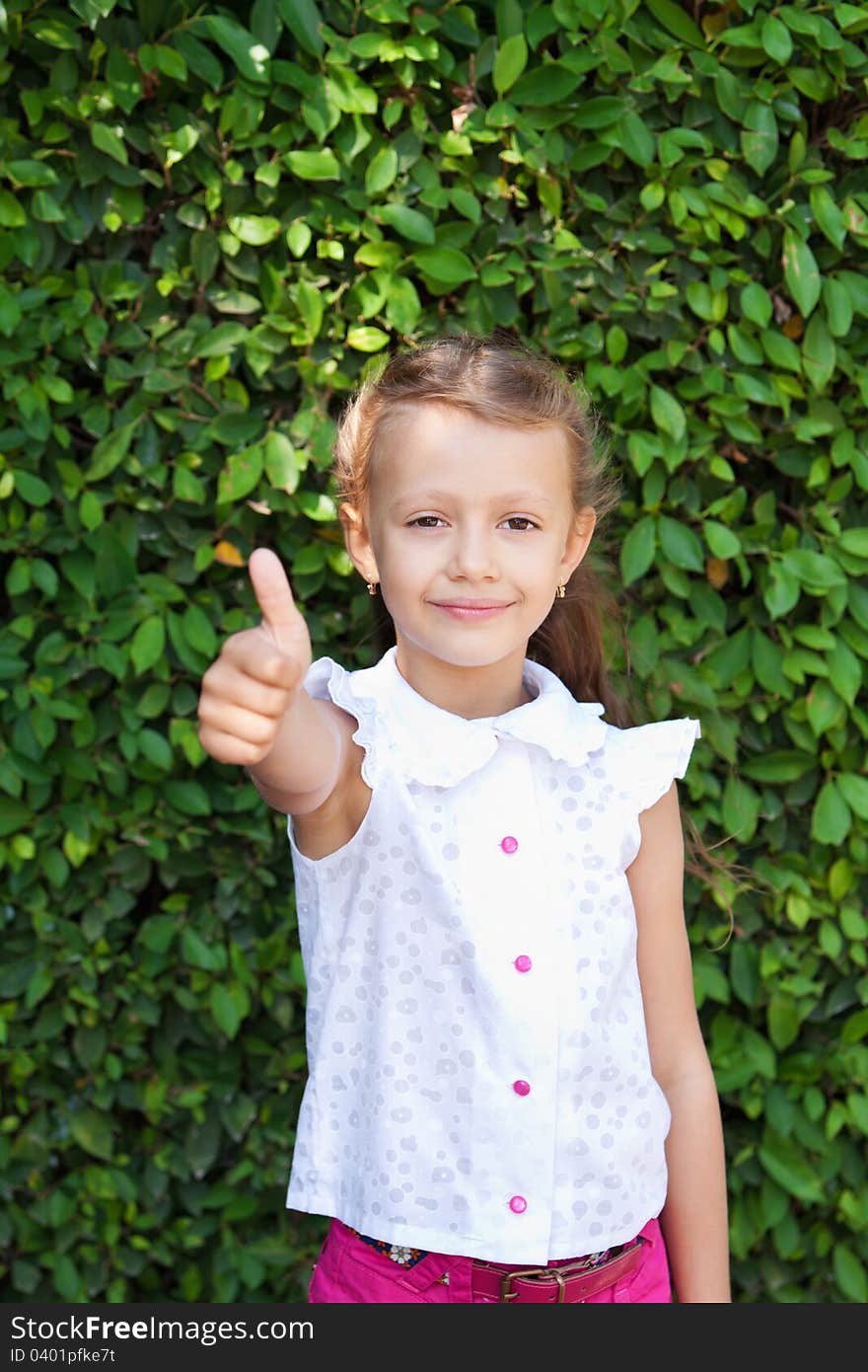 A girl shows a sign of excellent