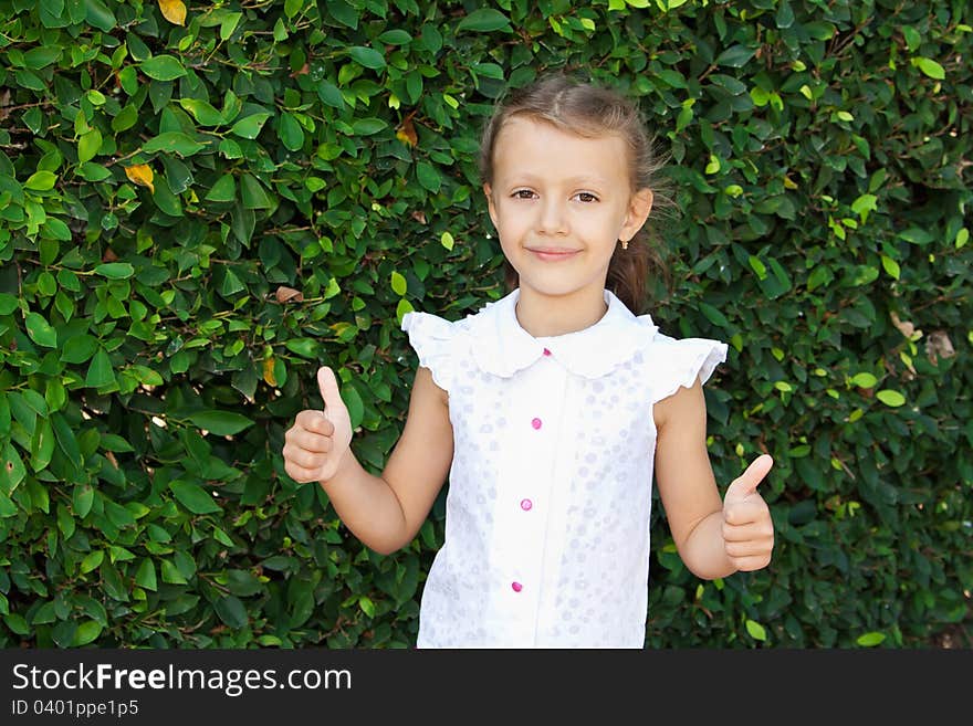 A girl shows a sign of excellent