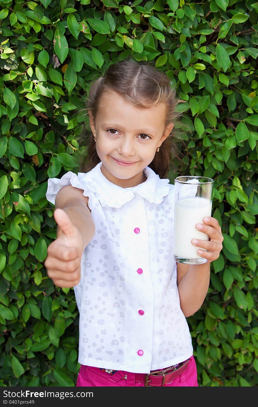 Girl Holding A Glass Of Milk