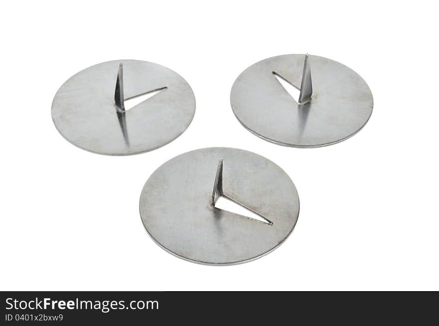 Three drawing pins (thumbtacks) isolated against a white background