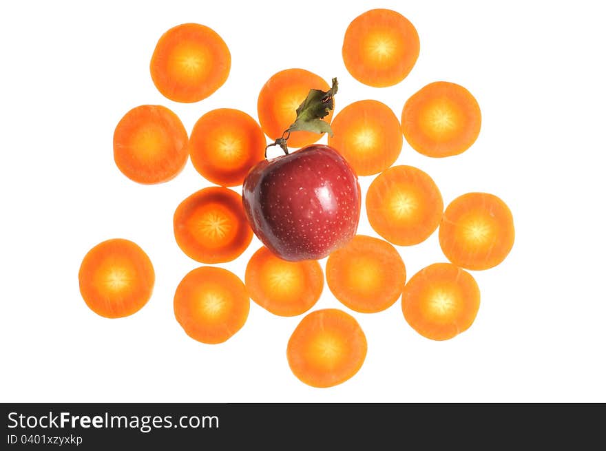 A red apple with carrot slices isolated on a white background