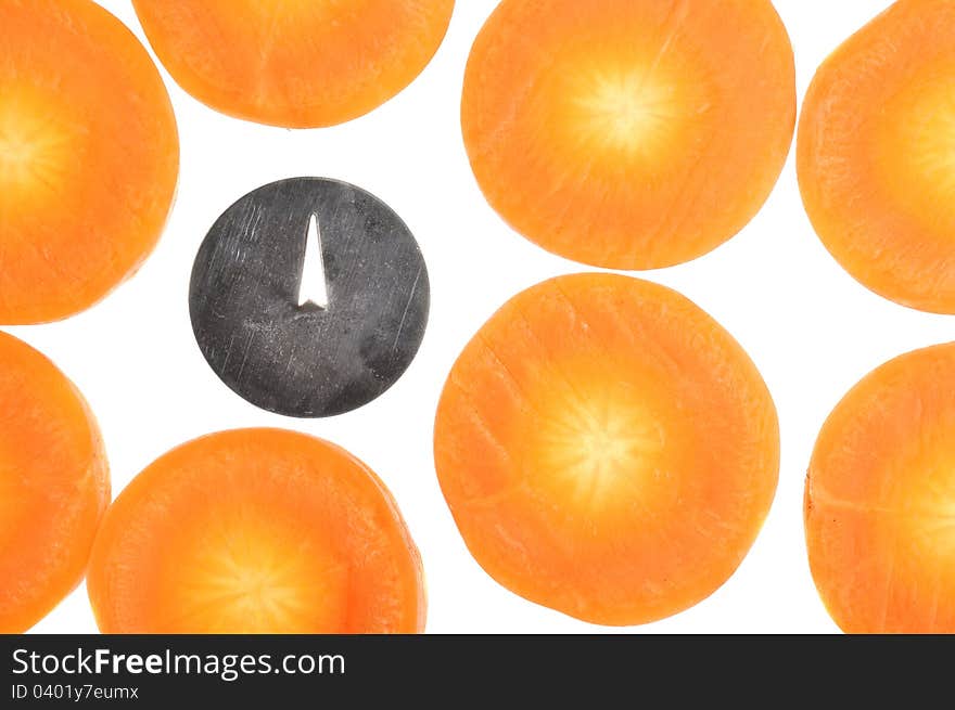 A conceptual image of a drawing pin (symbolizing bad bacteria) among carrot slices. A conceptual image of a drawing pin (symbolizing bad bacteria) among carrot slices