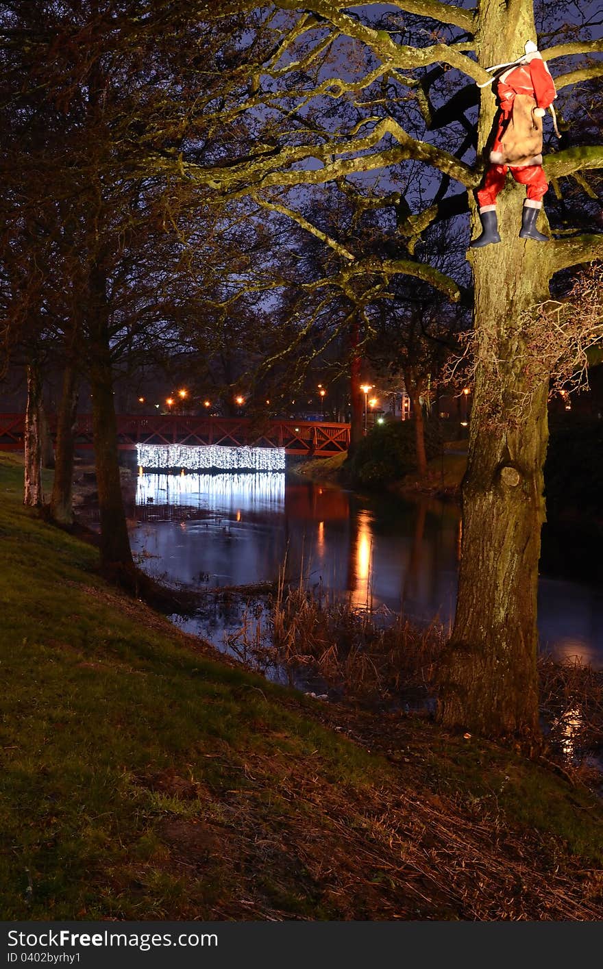 Night park view for climbing Santa Claus. Night park view for climbing Santa Claus