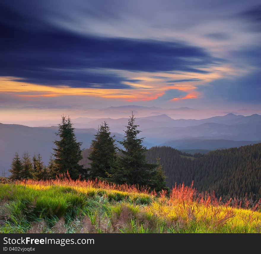 Landscape in the mountains with a cloudy sky colors the sunset. Ukraine, the Carpathian mountains. Landscape in the mountains with a cloudy sky colors the sunset. Ukraine, the Carpathian mountains