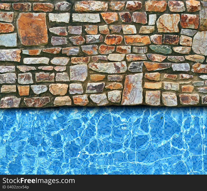 Irregular stone pavement with pool background