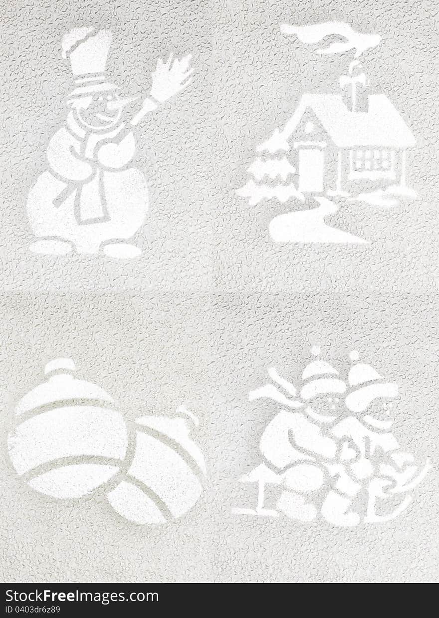 Four winter icons drawn on glass with white