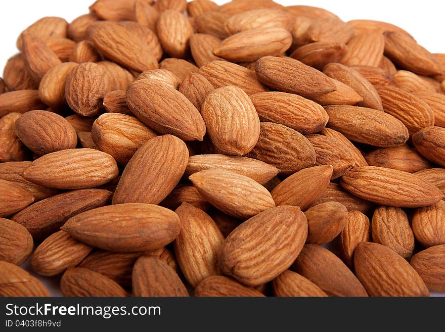 Pile of  almonds isolated over white background