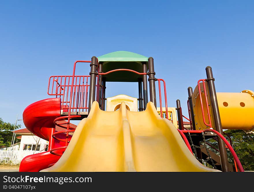 An image of a colorful children playground, without children. An image of a colorful children playground, without children