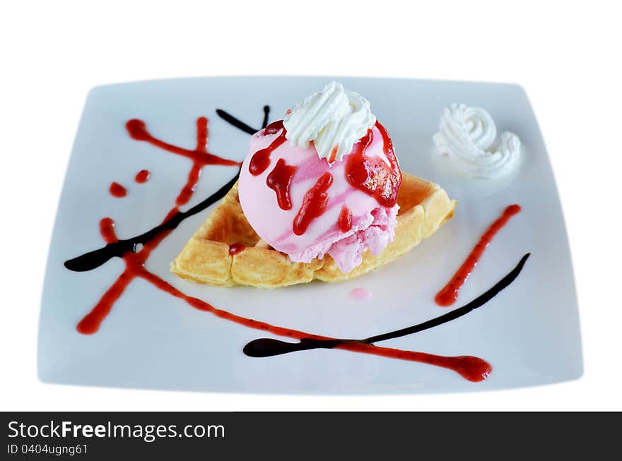 Waffle and whipping cream with strawberry ice cream. Waffle and whipping cream with strawberry ice cream