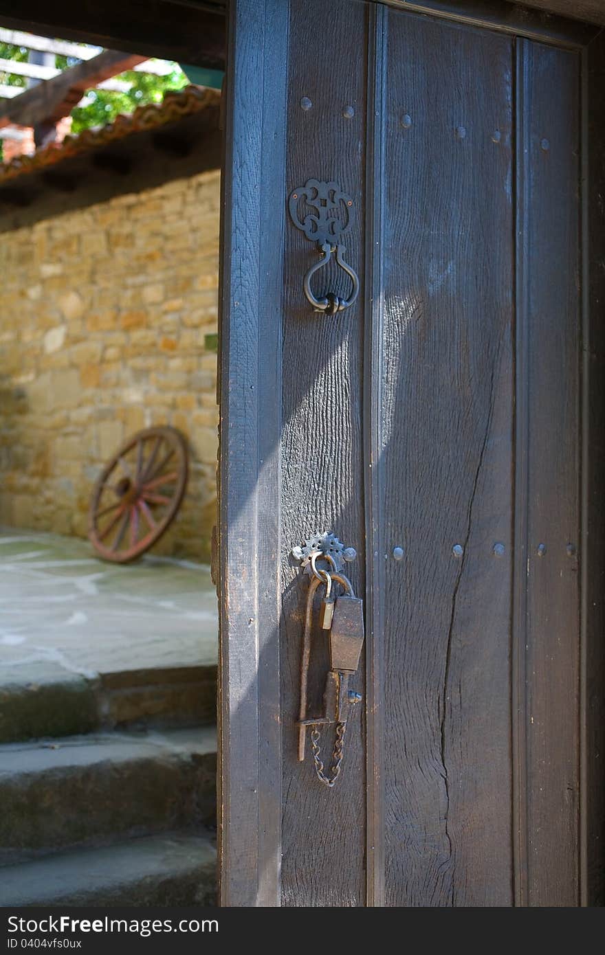 Ancient wooden door with ancient security lock of an old house in Jeravna &#x28;Zheravna&#x29;  village, Bulgaria