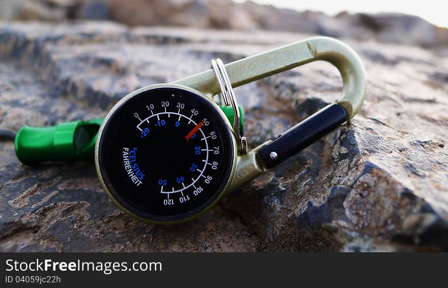 This is a simple outdoor thermometer, this photo was taken on rock, a mountain peak