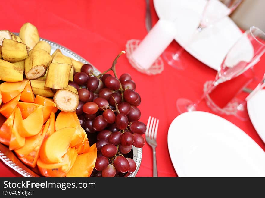 Table with plates and fruits