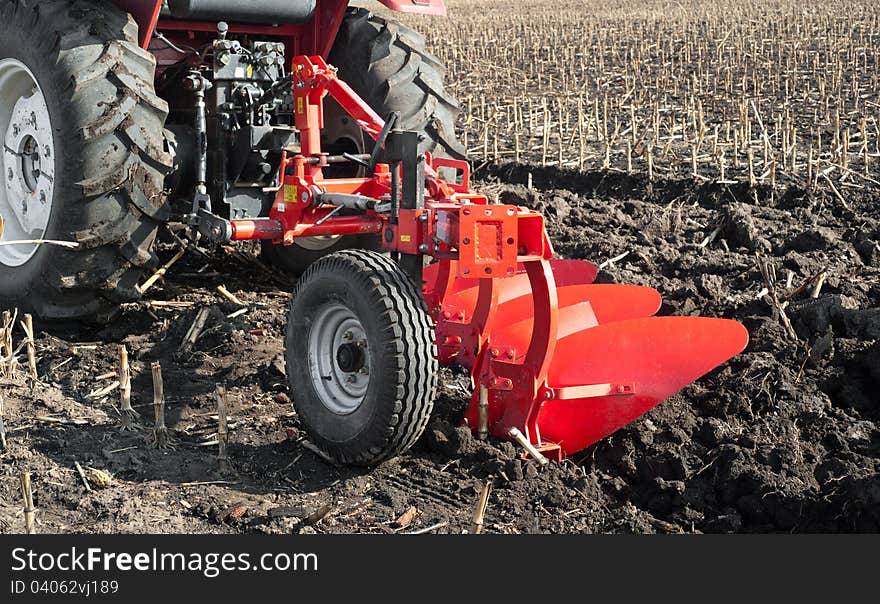 Tractor Plowing In Autumn