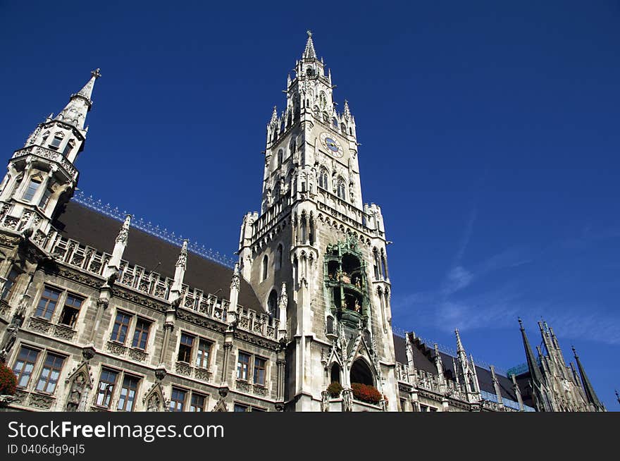 The Neues Rathaus (new city town hall) in Marienplatz, the main square in the Bavarian capital of Munich. The city hall has the famous Glockenspiel which attracts millions of tourists. The Neues Rathaus (new city town hall) in Marienplatz, the main square in the Bavarian capital of Munich. The city hall has the famous Glockenspiel which attracts millions of tourists.