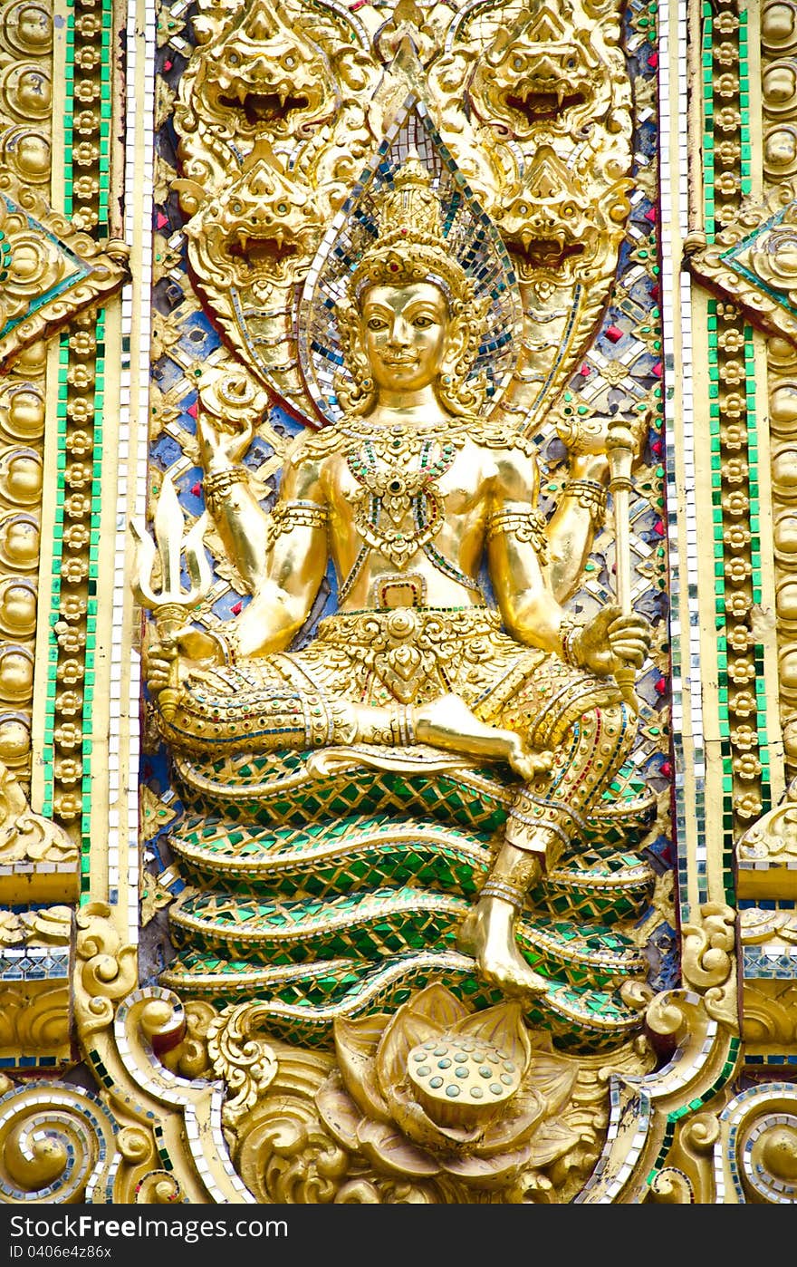 The golden Buddha statue. Sitting on the serpent.