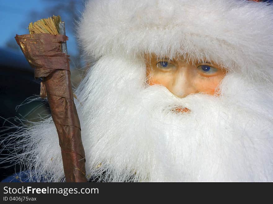 Closeup portrait of Santa Claus doll showing full beard