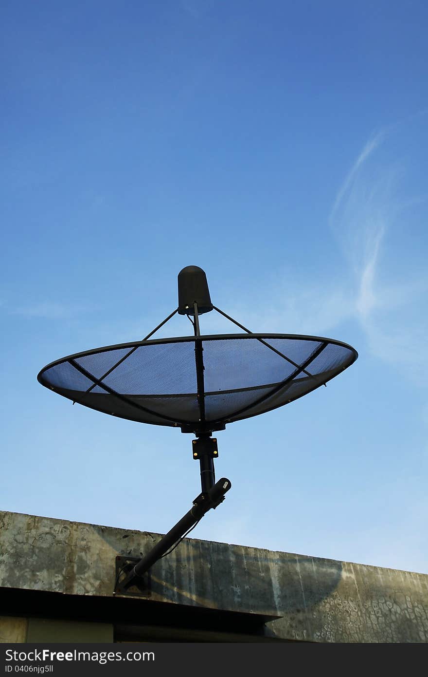 Satellite dish in blue sky