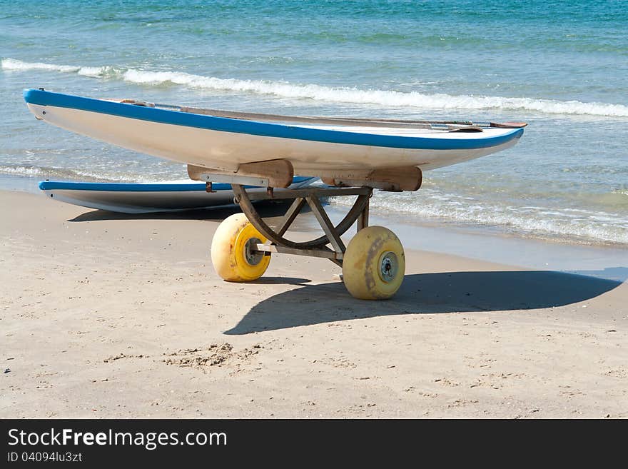 Classical surf boards on a  sandy beach ready for extreme action sport