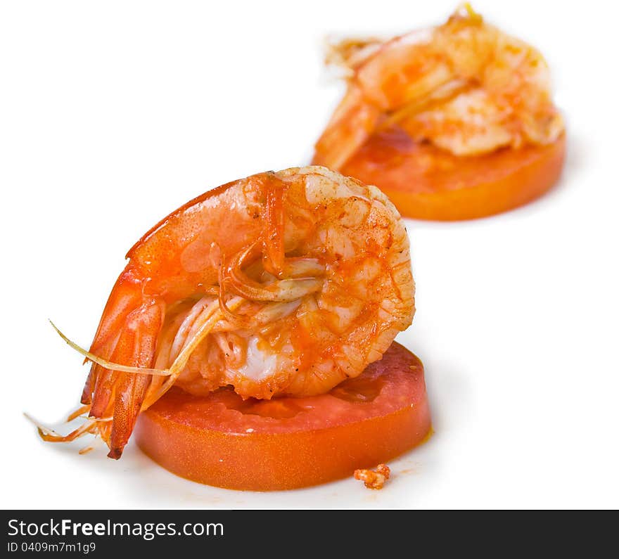 Delicious fried prawn on tomato. Delicious fried prawn on tomato.