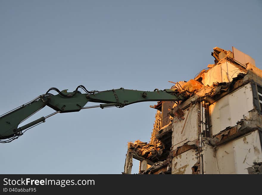 Demolition digger working in high place