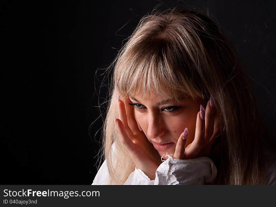 Portrait of girl on a dark background