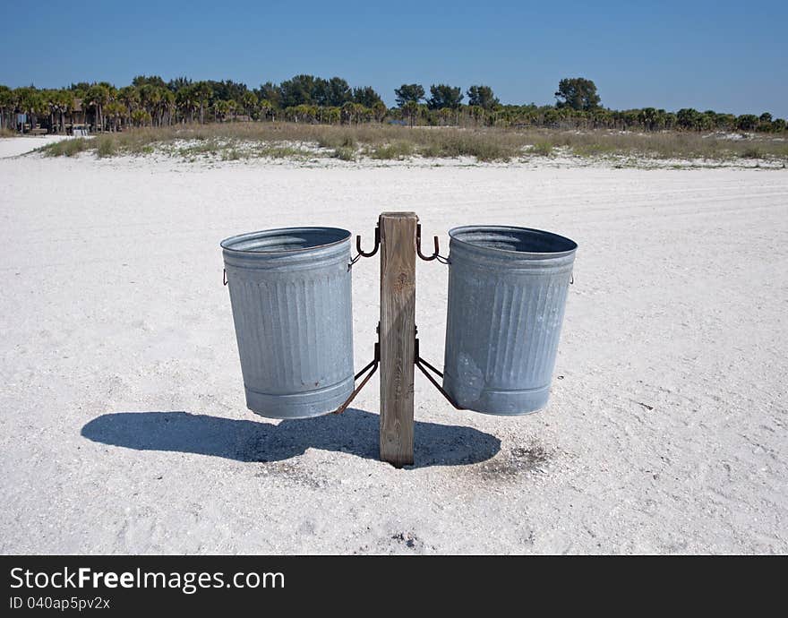 Pair of trash cans on a beach