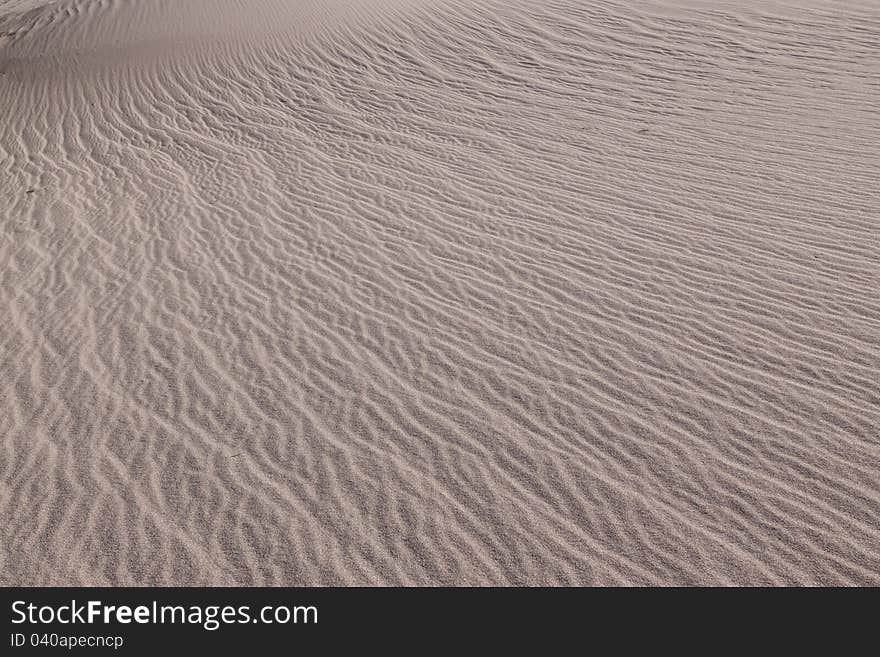 This image captures the intricate patterns of the Mesquite sand dunes in Death Valley National Park. This image captures the intricate patterns of the Mesquite sand dunes in Death Valley National Park.