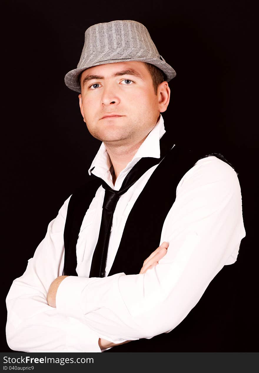 Portrait of young beautiful man in the hat