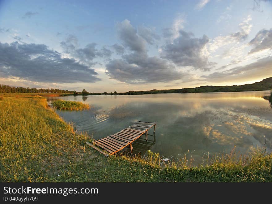 Lake, wood bridge, sunset