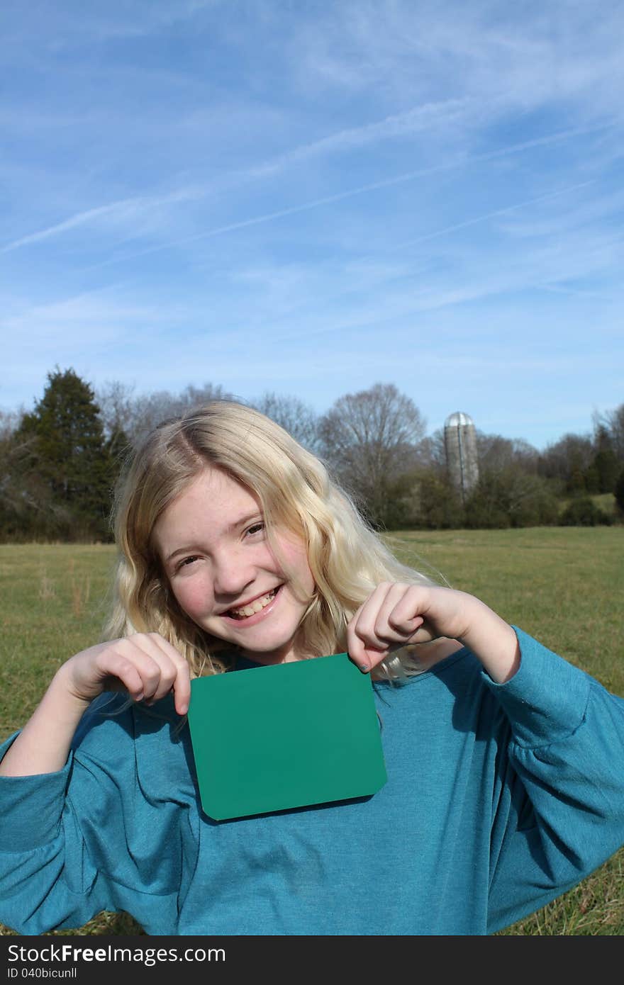 Young Girl Holding a Sign