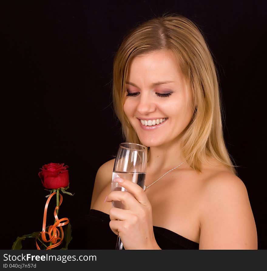 Beautiful woman smelling roses