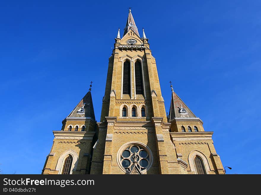 Old church clock tower with blue sky. Old church clock tower with blue sky