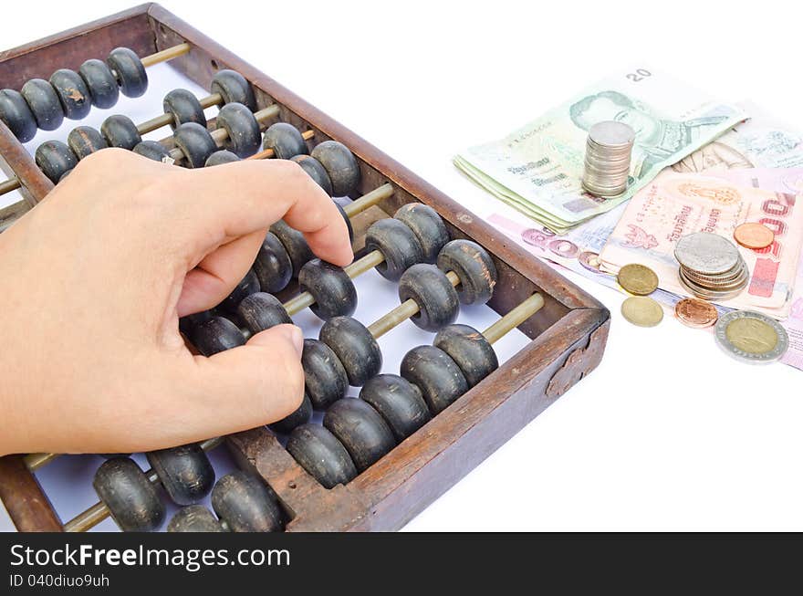 Hand using Abacus on white background