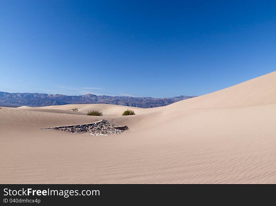 This image captures the intricate patterns of the Mesquite sand dunes in Death Valley National Park. This image captures the intricate patterns of the Mesquite sand dunes in Death Valley National Park.