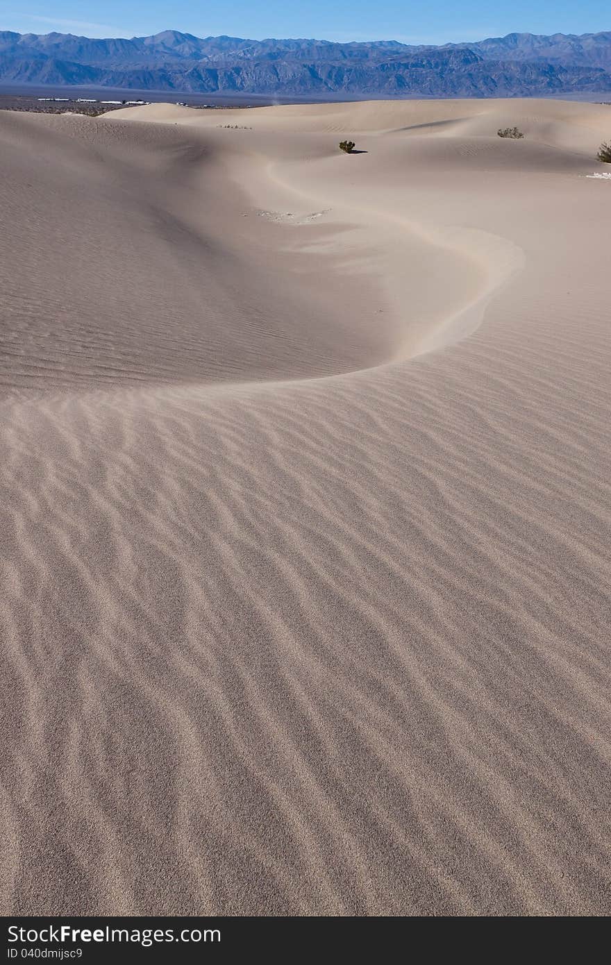 This image captures the interesting patterns of the Mesquite sand dunes in Death Valley National Park. This image captures the interesting patterns of the Mesquite sand dunes in Death Valley National Park.