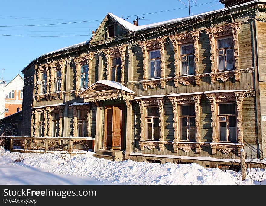 Facade Of The Old Wooden Building In Winter