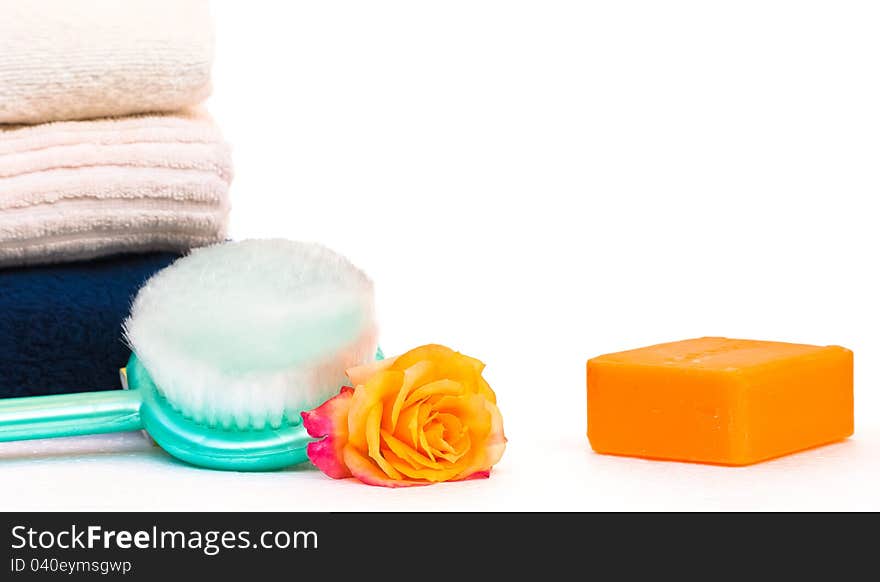 Towels,soap and rose,beauty spa concept,on white background. Towels,soap and rose,beauty spa concept,on white background