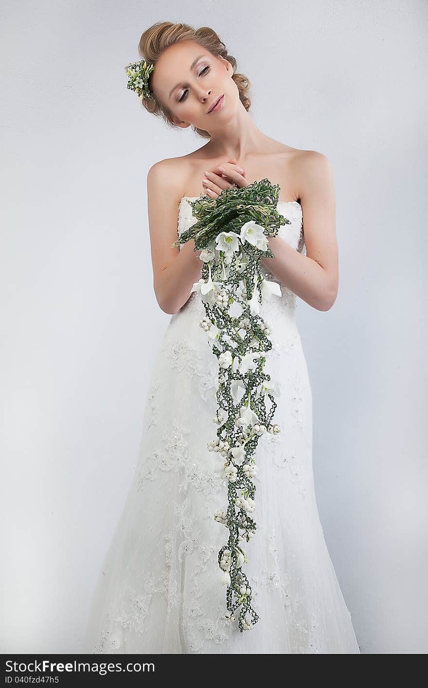 Lovely Bride Blonde With Bouquet Of Fresh Flowers