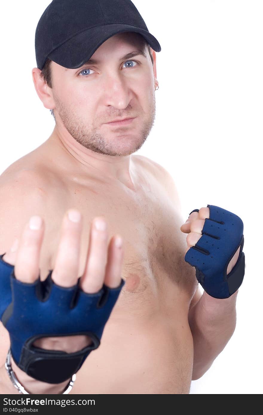 Naked man in gloves in a pose of a boxer. Naked man in gloves in a pose of a boxer