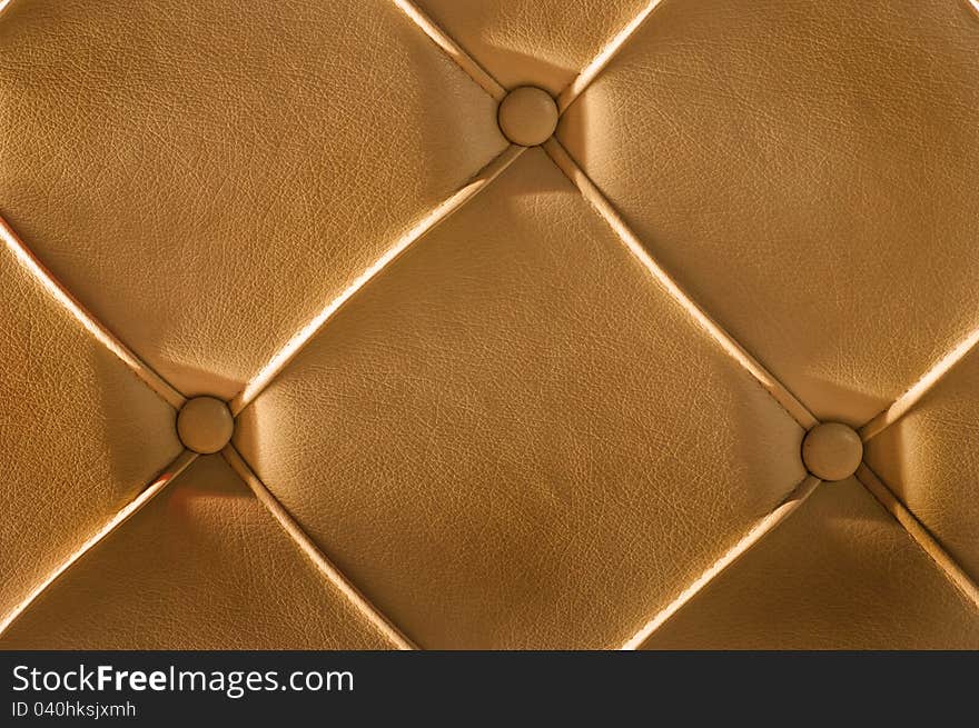 Luxury golden leather close-up background. Luxury golden leather close-up background