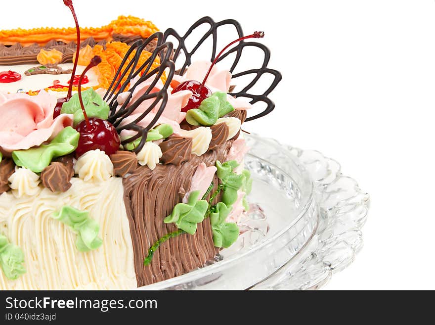 Cream cake with cherries isolated on a white background