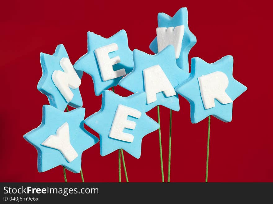 Sugar letters for a cake spelling New Year. Sugar letters for a cake spelling New Year