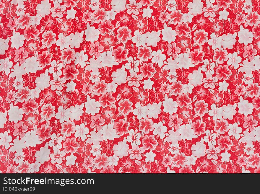 Alternating red and white flower pattern on the cloth. Alternating red and white flower pattern on the cloth.