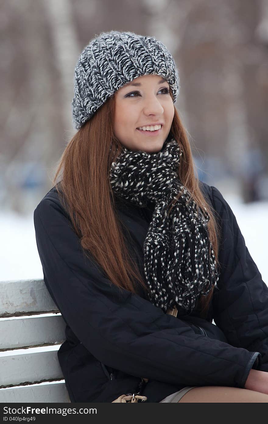 Girl sits on a bench